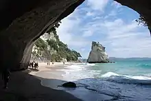 Sea arch at Cathedral Cove, carved in tuff deposited by a pyroclastic flow about 8 million years ago