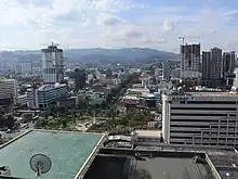 Fuente Osmeña Circle and at the end of point in of Osmeña Boulevard above of them is Cebu Provincial Capitol