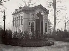 A chalet de nécessité, or public toilet, with a façade sculpted by Emile Guadrier, built near the Champs Elysees. (1865).