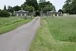 Cheltenham Lodges including gates, gate piers and adjoining walls