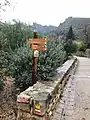 A sign marking the Way of Saint James in Saint Guilhem le Désert