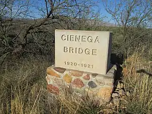 Concrete marker for Ciénega Bridge showing dates of construction.