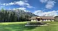 South aspect of Cinnamon Peak (left) and Mount Robson Provincial Park visitor centre.