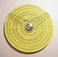 Pickett circular slide rule with two cursors. (4.25 in/10.9 cm width) Reverse has additional scale and one cursor.