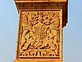 Bas-reliefs around the base showing the coat of arms of the Emperor of India, designed by the British sculptor Charles Sargeant Jagger