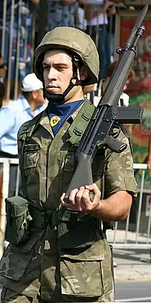 A National Guard soldier standing still with a G3A3 rifle.