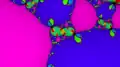 Newton fractal for a 7th order polynomial, colored by root reached and shaded by rate of convergence.