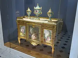 Louis XVI style commode of Madame du Barry; by Martin Carlin (attribution); 1772; oak base veneered with pearwood, rosewood and amaranth, soft-paste Sèvres porcelain, bronze gilt, white marble; 87 x 119 cm; Louvre