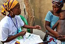 Delivery of malaria treatment by community health worker in Djénébougou, Mali. October 2013.