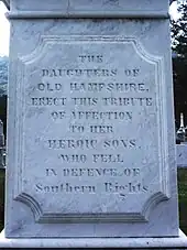 An image of the inscription etched into the façade of the memorial