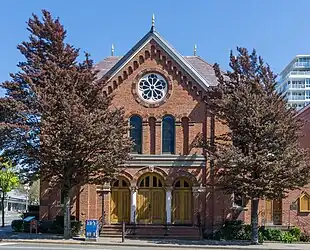 The red brick front facade of the synagogue