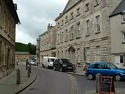 Cirencester Park wall, gates, lodges and  Corinium Museum of Roman Antiquities