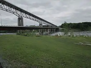 New 2014 bridge between Cornwall and Akwesasne, Ontario, Canada. New bridge is lower bridge. Old bridge is higher bridge. It is scheduled to be removed.