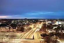 Night view of the road and slip roads with car headlights forming a continuous strip along the anticlockwise carriageway