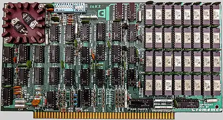 1970s Cromemco 16KZ, a 16KB DRAM memory S-100 bus card.  The green round disc parts are decoupling capacitors.