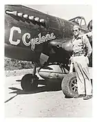 Cyclone Davis standing next to his P-40