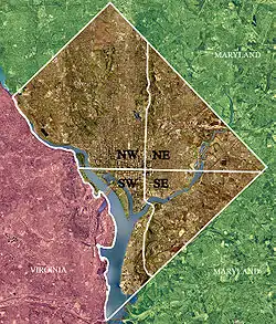 Color-enhanced 2002 USGS satellite image of Washington, D.C. The crosshairs in the image mark the quadrant divisions of Washington, D.C., with the United States Capitol at the center of the dividing lines. To the west of the Capitol is the National Mall, which is visible as a slight green band in the image. The Northwest quadrant is the largest, located north of the National Mall and west of North Capitol Street.