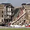 A portion of the Pentagon charred and collapsed, exposing the building's interior