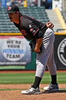 A baseball player in black and gray