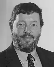 Head and shoulders portrait of a man in a suit