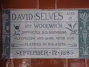 A tablet formed of six standard sized tiles, bordered by green flowers in the style of the Arts and Crafts movement