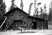 Dog feed cache and sled storage building