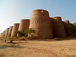 A large stone fortress in an arid area