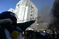 Helmeted combatant fires a slingshot during clashes on February 18, 2014, in Kyiv, Ukraine