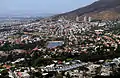 The City Bowl with the suburbs of Devil's Peak Estate, Vredehoek (and the three Disa Park towers in the background), Oranjezicht and Gardens, with Molteno Dam in the foreground.