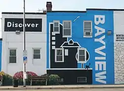 "Discover Bayview" mural on the side of a dental office on Eastern Avenue near the intersection with Dundalk Avenue