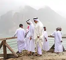 Gulf Arabs wearing traditional 'athwaab and culturally-specific headwear in Omen