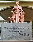 Statue of Don Bosco at the college entrance