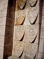 Shields on the outside of the ossuary of towns and cities who contributed to its cost.