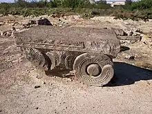 Ancient stone capital with fern-like relief at the archaeological site of Dvin