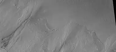 Close-up of gully aprons showing they are free of craters; hence very young.  Location is Phaethontis quadrangle.  Picture was taken by HiRISE under HiWish program.