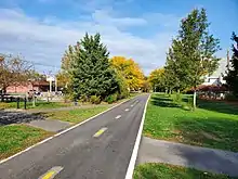 Two paved bike lanes extend into the distance (from Rhode Island)