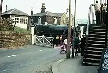 44806 Passing Helmshore signal box while on her way to the Lakeside and Haverthwaite Railway.