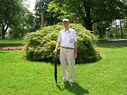 Ed Richardson with Japanese Threadleaf Maple, June 2013 This tree was planted in honor of Mr. Richardson's work measuring and mapping the trees of Cedar Hill Cemetery.