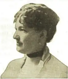 B&W portrait photo of a woman with her hair in an up-do