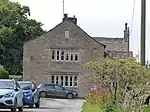 Elslack Hall Farmhouse and Elslack Hall Cottage with garden wall adjoining to north