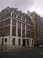 The embassy building today. While the façades of the two houses that stood on this site, with slightly different designs, can still be distinguished, the two doorways were replaced with one during the 1970s rebuilding.