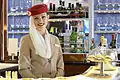 Emirates flight attendant in the A380 bar for Emirates