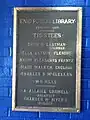 Plaque from 1910 details the architects, trustees of the library.