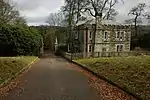 Gateway and flanking walls at the east entrance to Lanhydrock Park