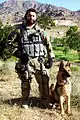 A U.S. Air Force Security Forces dog handler attached to the Army's 3rd Special Forces Group in Afghanistan with a German Shepherd.