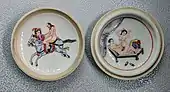 A covered Chinese porcelain plate, c. 1900, showing two scenes of couples having sexual intercourse, one on horseback