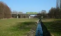 Tatra RT6N1 on overpass over Bogdanka, Poznański Szybki Tramwaj