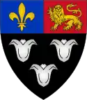 Arms of Eton College: Sable, three lily-flowers argent on a chief per pale azure and gules in the dexter a fleur-de-lys in the sinister a lion passant guardant.