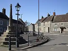 Village Cross to west of Church of St Peter