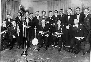 The Eveready Hour's election night broadcast from WEAF to 18 stations on November 4, 1924: Will Rogers (far right), Art Gillham, Wendell Hall, Carson Robison, Eveready Quartet, Graham McNamee and the Waldorf-Astoria Dance Orchestra.